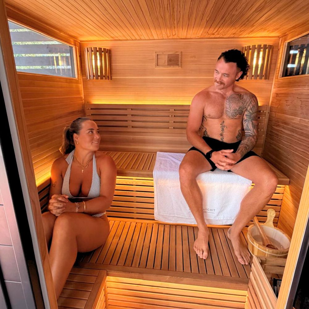 Two people in traditional sauna